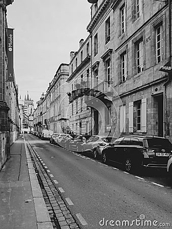 Cars parked in old street of Bordeaux, stock photo. Editorial Stock Photo
