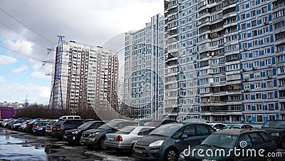 Cars in the Parking lot and high-rise residential buildings in winter Moscow Editorial Stock Photo