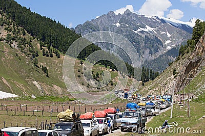 Cars with passengers stuck at the pass on the way Srinagar - Leh, Himalayas. India Editorial Stock Photo