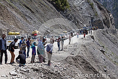 Cars with passengers stuck at the pass on the way Srinagar - Leh, Himalayas. India Editorial Stock Photo