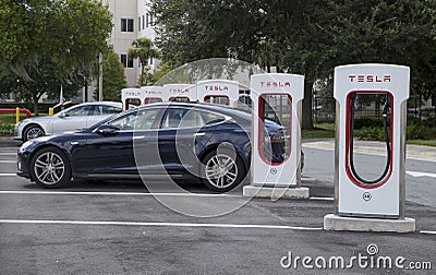 Cars recharging at Tesla stations on Florida Turnpike Editorial Stock Photo