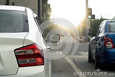 Cars on the road at day with prepare to start from light green. Stock Photo