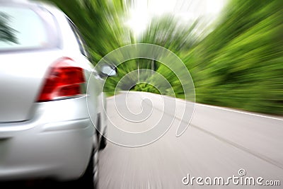 Cars rushed down the tree-lined streets. Stock Photo