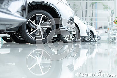 Cars For Sale, Automotive Industry, Cars Dealership Parking Lot. Rows of Brand New Vehicles Awaiting New Owners, on the epoxy Stock Photo