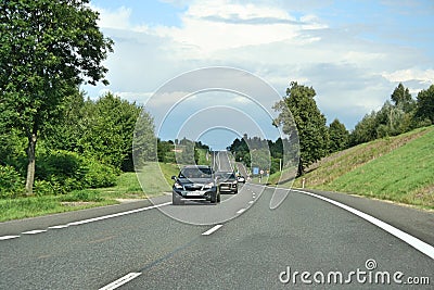 cars on the street. Urbanization, doads and transport infrastructure., Editorial Stock Photo