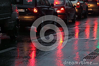 Cars in traffic jam on wet road Stock Photo