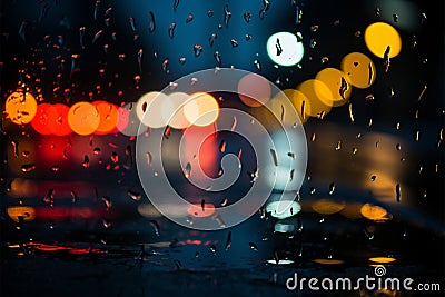 Cars view on a rainy night drive through glistening streets Stock Photo