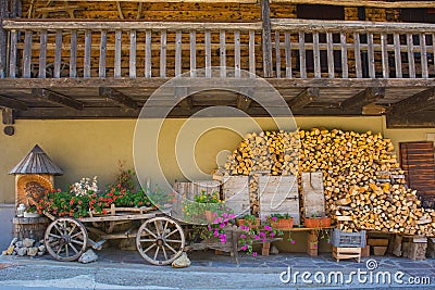 Cart and Flowers in Sauris di Sopra, Italy Stock Photo