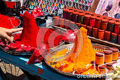 Cart with pigment powders for sale in the city of Pushkar Stock Photo
