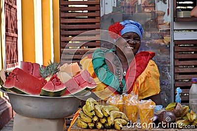 CARTAGENA, COLOMBIA - JULY 30: Palenquera woman sells fruit on July 30, 2016 in Cartagena, Colombia. Palenqueras are a unique Editorial Stock Photo