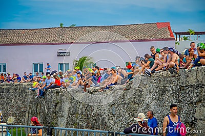CARTAGENA, COLOMBIA - NOVEMBER 07, 2019: Unidentified spectators sitting in a wall at the independence day parade on the Editorial Stock Photo