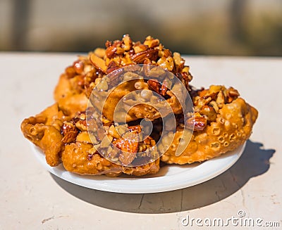 Cartellate Pugliesei italian traditional food from Puglia region named crispy puff pastry with honey and almond Stock Photo