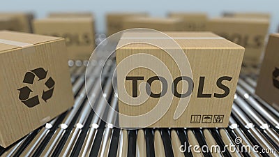 Carton boxes with TOOLS text move on roller conveyor. Realistic 3D rendering Stock Photo
