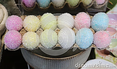 A carton of pastel glittery fuzzy decorative Easter eggs Stock Photo