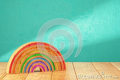Cartoon styled rainbow on wooden table Stock Photo