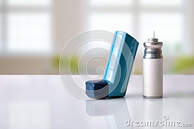 Cartridge and blue medicine inhaler in a room front view Stock Photo