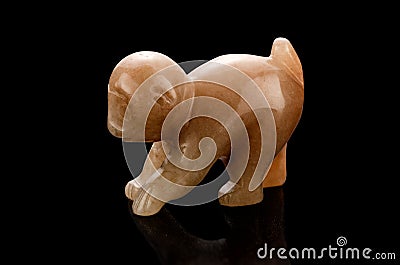 Carved aragonite monkey Stock Photo