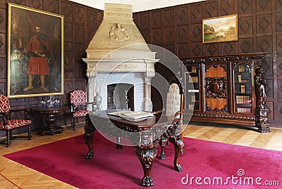 Carved furniture with lion legs, and marble fireplace Editorial Stock Photo