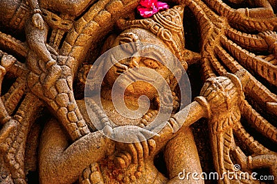 Carved idol on the outer wall, Hatkeshwar Mahadev, 17th century temple, the family deity of Nagar Brahmins. Vadnagar Stock Photo