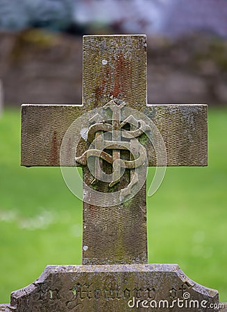 Carved IHS monogram on a headstone cross Stock Photo