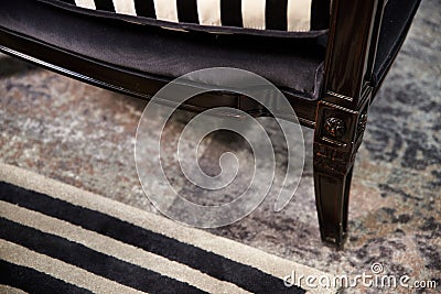 Carved legs of lacquered wood chair Stock Photo