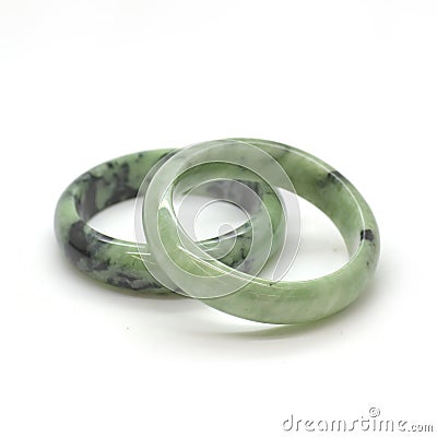 Carved and polished jade bangles. Green oriental gemstone bracelets Stock Photo
