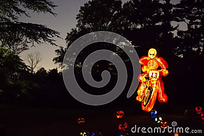 Halloween Pumpkin Art: Skeleton on Motorcycle Editorial Stock Photo