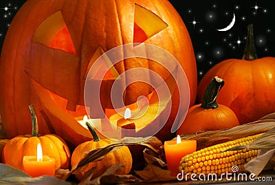 Carved pumpkin with candles Stock Photo