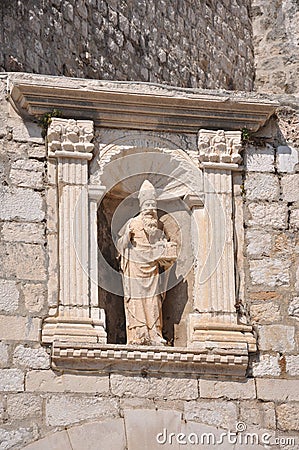 Carved saint above the inner section of the Ploce Gate, part of the walls surrounding Dubrovnik Old Town Stock Photo