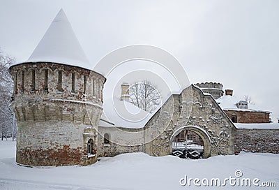 Carved stone gate and tower Fedorovsky town cloudy winter day. Tsarskoye Selo Stock Photo