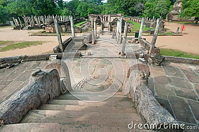 Carved stone stairways and ccolumns of broken Buddha temples from 12th century, Polonnaruwa, Sri Lanka. UNESCO Site Stock Photo