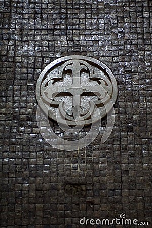 Carved stone symbol on a tile wall Editorial Stock Photo