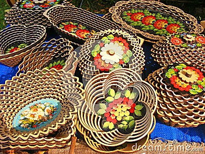 Carved traditional russian and slavic wooden tableware, handmade kitchen dishes and tableware, belarussian culture Stock Photo