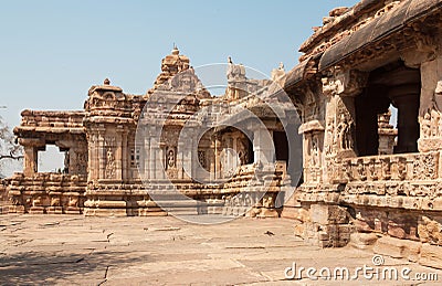 Carved wall in front of the 7th century Hindu temples in Pattadakal, India. UNESCO World Heritage site. Stock Photo