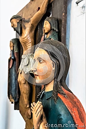 Russia, Rostov, July 2020. Wooden figure of the Virgin at the crucifix in the museum. Editorial Stock Photo