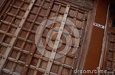 A carved wooden door in Stone Town in Zanzibar Editorial Stock Photo