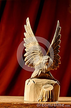 The carved wooden eagle froze in the wingspan Stock Photo