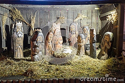 Carved wooden Nativity scene with Jesus at Christmas time Stock Photo