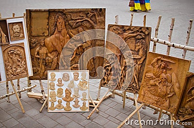 Carved wooden paintings outdoors. Editorial Stock Photo