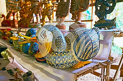 Carved wooden statuettes in market of Inn Thein Indein village Stock Photo