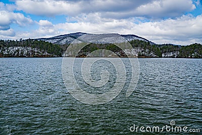 Carvin Cove Reservoir with a Snowy background of Tinker Mountain Stock Photo