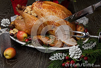 Carving Roasted Christmas Turkey with Grab Apples Stock Photo