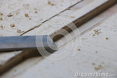 Chiseling a wood for making furniture Stock Photo