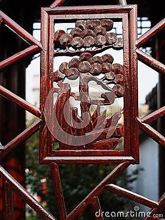 Carving on wooden window of Chinese garden building Stock Photo