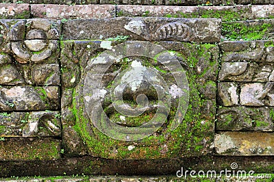 Carvings depicting demons, gods and Balinese mythological deities can be found throughout the Pura Dalem Agung Padangtegal temple Stock Photo