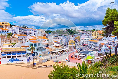 Carvoeiro, Portugal, June 19, 2021: People are strolling towards Editorial Stock Photo