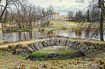 Cascade bridge, Slavyanka river and Pavlovsk Palace. Stock Photo