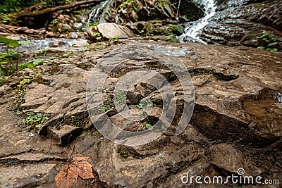 The cascade of a cold river waterfall falls on stones, cascades on a mountain river. The concept of active holidays, holidays Stock Photo