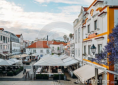 Busy touristic restaurants and bars area in the center of Cascais with traditional Portuguese architecture Editorial Stock Photo