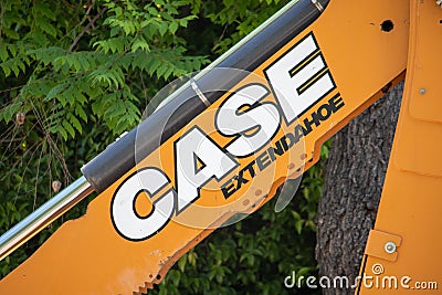 A CASE Extendahoe logo on a CASE 590 Super N Backhoe Loader at a construction site Editorial Stock Photo